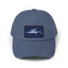 Blue baseball cap with a shark patch on the front.