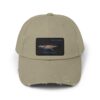 Beige cap with a rectangular patch showing a scenic sunset over water.