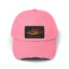 A pink baseball cap with a fish patch.