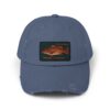 A blue baseball cap with a fish patch on the front.