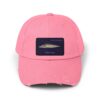 A pink baseball cap with a fish patch on the front.
