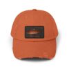 Orange baseball cap with a fish patch on the front.