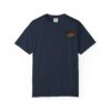 A navy blue T-shirt with a small, colorful graphic on the chest pocket area.
