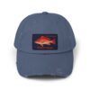A blue baseball cap with a red fish patch on the front.