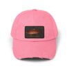 A pink baseball cap with a rectangular fish image patch.