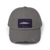 A gray baseball cap with a fish illustration on a purple patch.