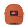 Orange baseball cap with a fish patch on the front.