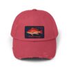 A red baseball cap with a fish patch on the front.