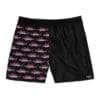 Black shorts with pink and black fish pattern on one side.