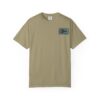 A beige T-shirt with a small blue graphic on the front pocket area.