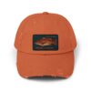 Orange baseball cap with a fish patch on the front.