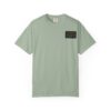 Light green t-shirt with a small dark patch pocket on the chest.
