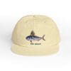 Beige cap with a blue fish illustration and 'THE SHARK' text.
