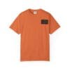 Orange T-shirt with a small black patch on the chest.