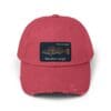 Red baseball cap with distressed details and a car patch.