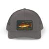 Gray cap with a colorful embroidered patch of a scenic landscape.