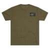 Olive green t-shirt with a small graphic patch on the chest.