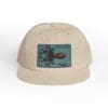 Beige baseball cap with an octopus patch on the front.