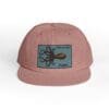 A pink baseball cap with an octopus patch on the front.