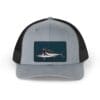 Gray and black trucker hat with a shark patch on the front.