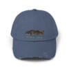 Blue baseball cap with a fish embroidery and distressed edges.