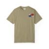 A beige t-shirt with a small colorful graphic on the chest pocket area.