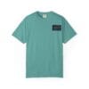 Teal short-sleeve t-shirt with a small black patch on the chest.