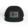 Black cap with a blue rectangular patch featuring a stylized squid design.