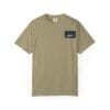 Beige t-shirt with a small black logo patch on the chest pocket area.