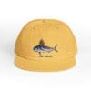 Yellow cap with a fish graphic and 'THE SHARK' text.