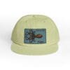 Light green cap with an octopus patch on the front.