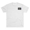 White T-shirt with a small rectangular graphic on the chest.