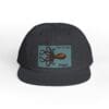 Black snapback cap with a blue patch featuring an octopus design.