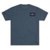 Simple blue T-shirt with a small rectangular logo on the chest.