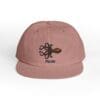 Mauve cap with black embroidered octopus and text.