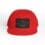 Red cap with a black patch featuring a fish design.