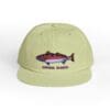 Light green cap with a colorful fish graphic and the text 'CATCHING SLUMS'.