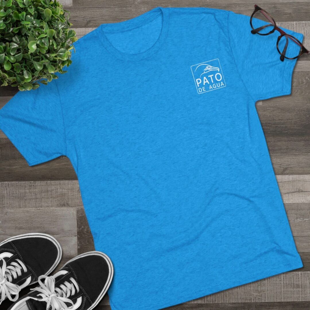 Bright blue casual t-shirt with a small white logo on the chest.