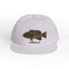 A white cap featuring an embroidered fish design labeled 'CABRILLA'.