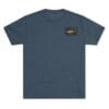 Dark blue crewneck t-shirt with a small rectangular black and gold patch on the chest.