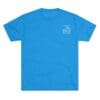 Blue T-shirt with a small white logo on the chest.