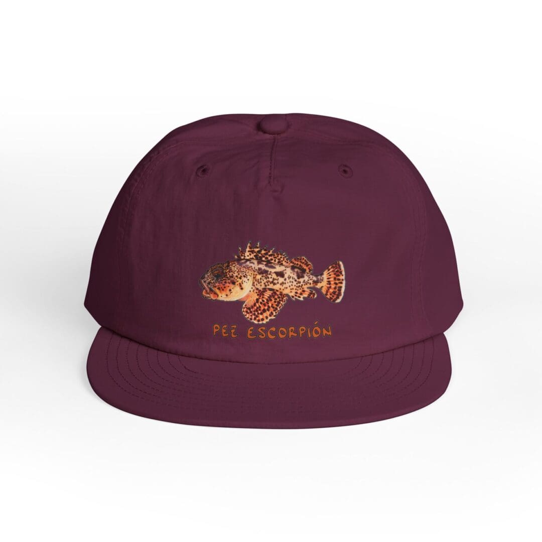 Maroon snapback cap with intricate golden embroidery.