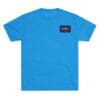 Bright blue t-shirt with a small rectangular logo on the chest pocket area.