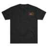 Black T-shirt with a small graphic on the chest pocket area.