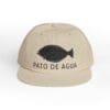 Beige cap with a black duck silhouette and 'Pato de Agua' text.