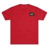 Red T-shirt with a small black rectangular patch on the chest.