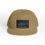 A tan baseball cap with a dark label on the front.