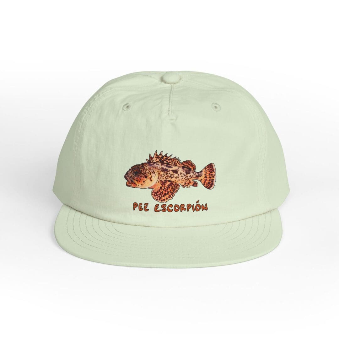 Light green cap with a detailed fish design on the front.