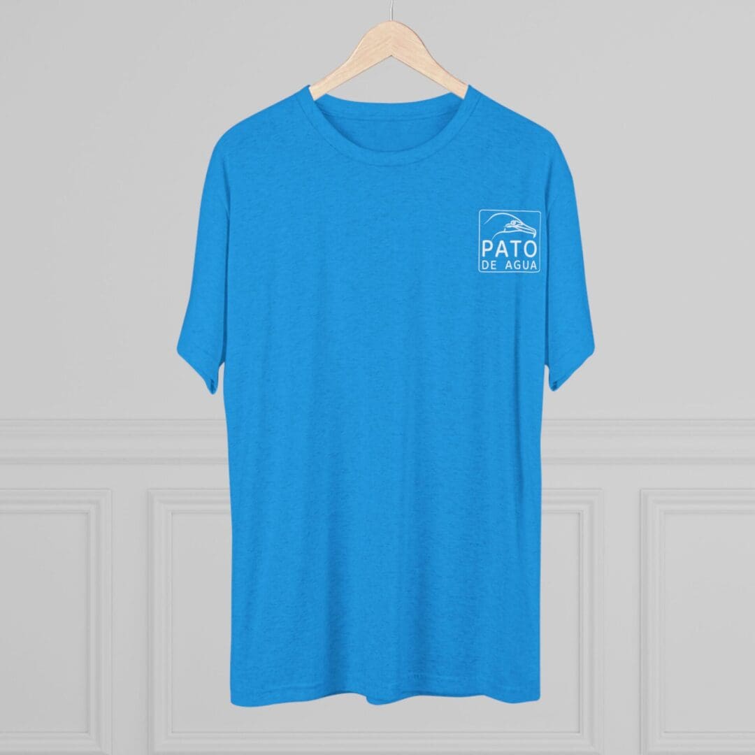 Bright blue t-shirt with small white text on the chest, hanging on a wooden hanger.