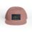 A dusty pink six-panel cap with a mountain-themed patch.